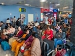 Passengers stranded at Kempegowda International Airport amid flight disruptions in Bengaluru on Friday. (PTI)