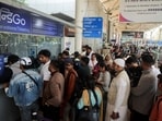 Passengers wait outside the IndiGo airlines ticketing counter at the Chhatrapati Shivaji Maharaj International Airport, after several IndiGo airlines flights were cancelled, in Mumbai, on Saturday. (REUTERS) Passengers wait outside the IndiGo airlines ticketing counter at the Chhatrapati Shivaji Maharaj International Airport, after several IndiGo airlines flights were cancelled, in Mumbai, on Saturday. (REUTERS)