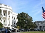 The US National flag flies at half staff on the South Lawn of the White House in Washington, DC on December 4, 2025,  in honor of Sarah Beckstrom (Photo by ANDREW CABALLERO-REYNOLDS / AFP)