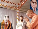 Uttar Pradesh chief minister Yogi Adityanath pays tribute to Dr BR Ambedkar on his death anniversary in Lucknow on Saturday. (PTI PHOTO) Uttar Pradesh chief minister Yogi Adityanath pays tribute to Dr BR Ambedkar on his death anniversary in Lucknow on Saturday. (PTI PHOTO)