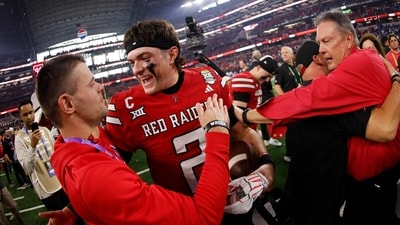 Texas Tech Red Raiders players celebrate after the team's win over the BYU Cougars for the Big 12 Championship at AT&T Stadium on December 6, 2025. (Getty Images via AFP) Texas Tech Red Raiders players celebrate after the team's win over the BYU Cougars for the Big 12 Championship at AT&T Stadium on December 6, 2025. (Getty Images via AFP)