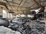 The charred interiors of a nightclub, which caught fire early Sunday, are seen in Arpora, Goa, India. (AP Photo) The charred interiors of a nightclub, which caught fire early Sunday, are seen in Arpora, Goa, India. (AP Photo)