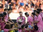 Lionel Messi celebrates lifting the MLS Cup with his teammates. Lionel Messi celebrates lifting the MLS Cup with his teammates.