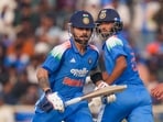 Virat Kohli and Washington Sundar run between the wickets during the first ODI between India and South Africa.