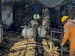 The charred remains at the nightclub where a fire broke out due to a cylinder blast, in North Goa district, on Sunday. (PTI) The charred remains at the nightclub where a fire broke out due to a cylinder blast, in North Goa district, on Sunday. (PTI)