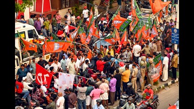 BJP workers during the final day of the election campaign for the Kerala local body polls in Thiruvananthapuram on Sunday. (PTI)