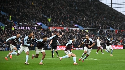 Aston Villa's Argentinian midfielder #10 Emiliano Buendia (4R) celebrates scoring the team's second goal during the English Premier League football match between Aston Villa and Arsenal at Villa Park in Birmingham, central England on December 6, 2025. (Photo by JUSTIN TALLIS / AFP) / RESTRICTED TO EDITORIAL USE. No use with unauthorized audio, video, data, fixture lists, club/league logos or 'live' services. Online in-match use limited to 120 images. An additional 40 images may be used in extra time. No video emulation. Social media in-match use limited to 120 images. An additional 40 images may be used in extra time. No use in betting publications, games or single club/league/player publications. / (AFP) Aston Villa's Argentinian midfielder #10 Emiliano Buendia (4R) celebrates scoring the team's second goal during the English Premier League football match between Aston Villa and Arsenal at Villa Park in Birmingham, central England on December 6, 2025. (Photo by JUSTIN TALLIS / AFP) / RESTRICTED TO EDITORIAL USE. No use with unauthorized audio, video, data, fixture lists, club/league logos or 'live' services. Online in-match use limited to 120 images. An additional 40 images may be used in extra time. No video emulation. Social media in-match use limited to 120 images. An additional 40 images may be used in extra time. No use in betting publications, games or single club/league/player publications. / (AFP)