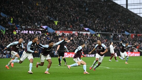 Aston Villa's Argentinian midfielder #10 Emiliano Buendia (4R) celebrates scoring the team's second goal during the English Premier League football match between Aston Villa and Arsenal at Villa Park in Birmingham, central England on December 6, 2025. (Photo by JUSTIN TALLIS / AFP) / RESTRICTED TO EDITORIAL USE. No use with unauthorized audio, video, data, fixture lists, club/league logos or 'live' services. Online in-match use limited to 120 images. An additional 40 images may be used in extra time. No video emulation. Social media in-match use limited to 120 images. An additional 40 images may be used in extra time. No use in betting publications, games or single club/league/player publications. / (AFP)