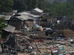 Families residing in slum clusters near Ballu Adda beside the flowing Haider Canal drain in Lucknow. (Deepak Gupta/HT Photo)