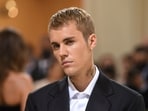 Bieber’s frustration stems from the small microphone icon that appears in the Messages text field on iPhones. (Invision)