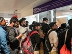 Passengers stand in a queue at an IndiGo airlines counter at Terminal 1 (T1) of the Indira Gandhi International Airport, in New Delhi. Passengers stand in a queue at an IndiGo airlines counter at Terminal 1 (T1) of the Indira Gandhi International Airport, in New Delhi.