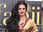 Rekha invites criticsim for her 'rude' behaviour towards fan at airport. Rekha invites criticsim for her 'rude' behaviour towards fan at airport.