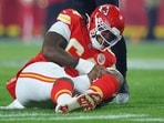 Wanya Morris #64 of the Kansas City Chiefs reacts after being injured against the Houston Texans Wanya Morris #64 of the Kansas City Chiefs reacts after being injured against the Houston Texans