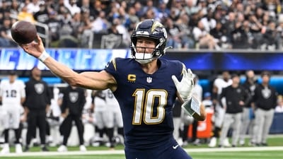 Justin Herbert #10 of the Los Angeles Chargers throws a touchdown pass against the Las Vegas Raiders (Getty Images via AFP) Justin Herbert #10 of the Los Angeles Chargers throws a touchdown pass against the Las Vegas Raiders (Getty Images via AFP)