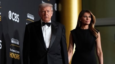 President Donald Trump and first lady Melania Trump look dashing in black as they walk the red carpet before the 48th Kennedy Center Honors, Sunday, Dec. 7, 2025, at the John F. Kennedy Center for the Performing Arts in Washington. (AP Photo/Julia Demaree Nikhinson) (AP) President Donald Trump and first lady Melania Trump look dashing in black as they walk the red carpet before the 48th Kennedy Center Honors, Sunday, Dec. 7, 2025, at the John F. Kennedy Center for the Performing Arts in Washington. (AP Photo/Julia Demaree Nikhinson) (AP)