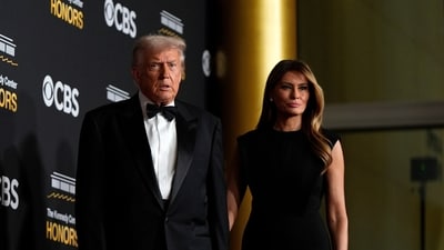 President Donald Trump walks alongside his wife Melania the red carpet before the 48th Kennedy Center Honors, Sunday, Dec. 7, 2025, at the John F. Kennedy Center for the Performing Arts in Washington. (AP Photo/Julia Demaree Nikhinson) (AP) President Donald Trump walks alongside his wife Melania the red carpet before the 48th Kennedy Center Honors, Sunday, Dec. 7, 2025, at the John F. Kennedy Center for the Performing Arts in Washington. (AP Photo/Julia Demaree Nikhinson) (AP)