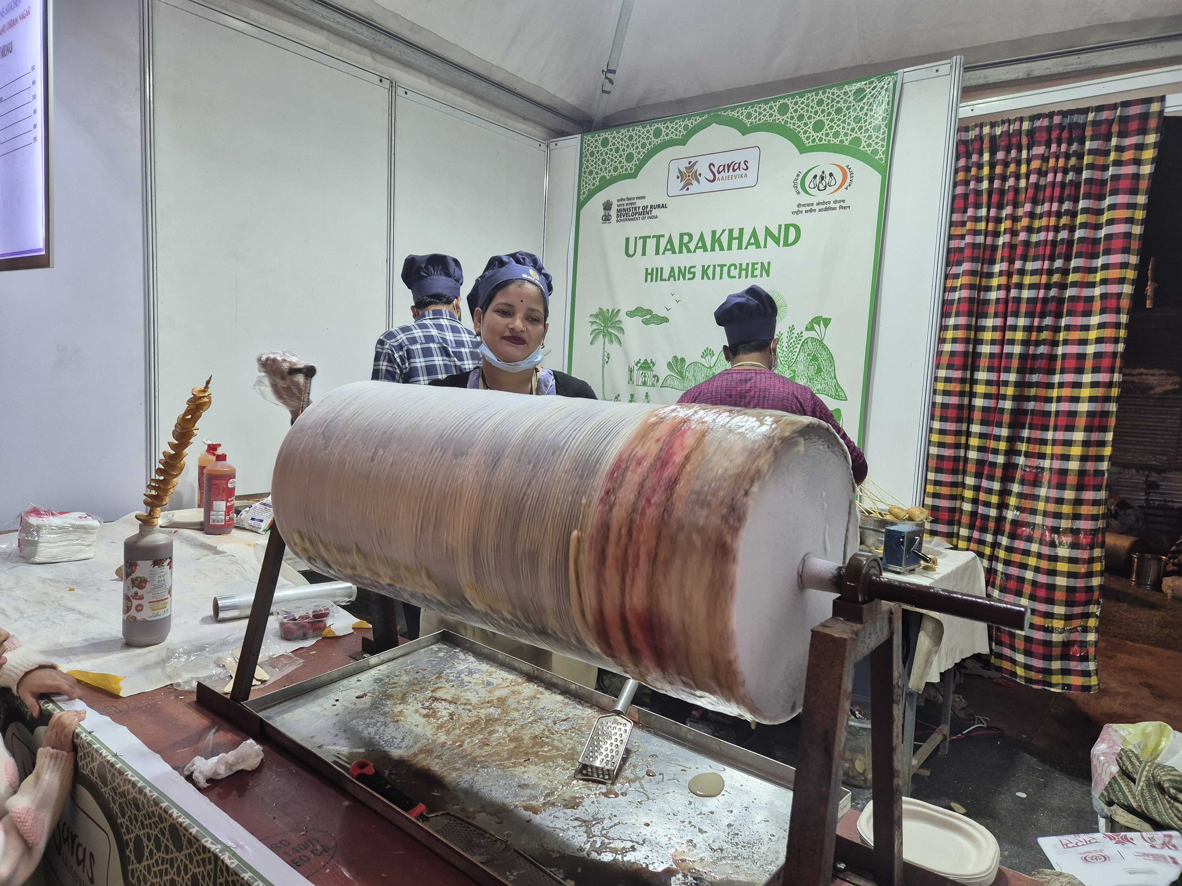 Delhi winter is ready for this roller fruit ice cream at Uttarakhand's stall. Delhi winter is ready for this roller fruit ice cream at Uttarakhand's stall.