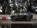 An aromoured vehicle is positioned at the entrance of a blocked road next to the National Television, Benin TV, in Cotonou, on December 08, 2025. Benin's president said the "situation is completely under control" in his country after the government thwarted an attempted coup thanks to loyalist soldiers with support from Nigerian forces.