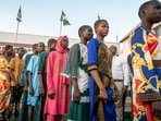 A group of freed school children line up to enter the Governor's office in Minna on December 8, 2025. Around a hundred schoolchildren who were abducted last month by armed men from a Catholic school have arrived at the government headquarters in Minna, the capital of Niger State in central-northern Nigeria. A group of freed school children line up to enter the Governor's office in Minna on December 8, 2025. Around a hundred schoolchildren who were abducted last month by armed men from a Catholic school have arrived at the government headquarters in Minna, the capital of Niger State in central-northern Nigeria.
