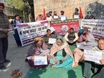 PSPCL staff protesting at Janta Nagar division office in Ludhiana on Monday. (Manish/HT)