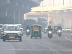 Vehicles commute through the Rao Tula Ram Marg area covered in smog.
Vehicles commute through the Rao Tula Ram Marg area covered in smog.