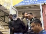 Ajay Gupta, one of the co-owners of Goa's 'Birch by Romeo Lane' nightclub, being brought to the Delhi Police Crime Branch office in connection with the blaze that killed 25 people, on Wednesday. (PTI)