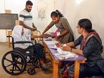 An elderly woman casts her vote during the first phase of Kerala local body elections, in Thiruvananthapuram on Tuesday.) (PTI)