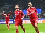 Liverpool's Dominik Szoboszlai (R) celebrates scoring a penalty kick with midfielder Alexis Mac Allister during the UEFA Champions League in Milan. (AFP)