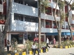 Patients sitting outside the Karnal civil hospital on Tuesday. (HT Photo) Patients sitting outside the Karnal civil hospital on Tuesday. (HT Photo)