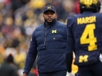 Head coach Sherrone Moore of the Michigan Wolverines is seen during warmups prior to the game against the Ohio State Buckeyes Head coach Sherrone Moore of the Michigan Wolverines is seen during warmups prior to the game against the Ohio State Buckeyes