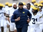 Head coach Sherrone Moore of the Michigan Wolverines leads his team off the field after warm-up before the game against the Maryland Terrapins Head coach Sherrone Moore of the Michigan Wolverines leads his team off the field after warm-up before the game against the Maryland Terrapins