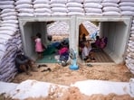 People take shelter inside a bunker amid deadly clashes between Thailand and Cambodia along a disputed border area in Sa Kaeo province, Thailand, December 10, 2025. REUTERS/Athit Perawongmetha