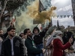 Syrians celebrating the first anniversary of the fall of the Assad regime in Damascus on Monday.