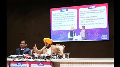 Punjab chief minister Bhagwant Mann, accompanied by chief secretary KAP Sinha, addressing the media in Chandigarh on Wednesday. (HT)
