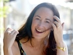 Author Sophie Kinsella poses on Wimbledon Village high street, London on September 9, 2004. (AP Photo/Adam Butle, File)