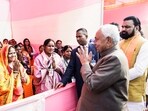 Bihar CM Nitish Kumar, along with Deputy Chief Minister Samrat Chaudhary, greets the rural women at the Higher Secondary School at Kesaria in East Champaran on Thursday (ANI)
