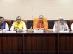 Chief minister Yogi Adityanath (centre) holds a meeting with public representatives on SIR and development related works, in Varanasi, Thursday. (PTI Photo)