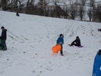 Families sled down a hill and play in the snow at Washington Park in Charlottesville, Va., after a winter storm dropped three inches of snow early in the morning on Friday, Dec. 5, 2025. (Cal Cary/The Daily Progress via AP) Families sled down a hill and play in the snow at Washington Park in Charlottesville, Va., after a winter storm dropped three inches of snow early in the morning on Friday, Dec. 5, 2025. (Cal Cary/The Daily Progress via AP)