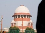 FILE PHOTO: A lawyer looks into his mobile phone in front India's Supreme Court (REUTERS) FILE PHOTO: A lawyer looks into his mobile phone in front India's Supreme Court (REUTERS)