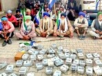 Farmers display removed smart meters as part of their protest against the Punjab and central governments over the Electricity Amendment Bill near Patiala on Wednesday. (PTI)