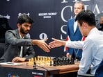 India's D Gukesh, left, and China's Ding Liren during the FIDE World Chess Championship 2024 in Singapore