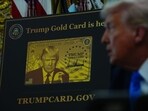 A Trump Gold Card sign as US President Donald Trump speaks to members of the media in the Oval Office of the White House in Washington, DC. A Trump Gold Card sign as US President Donald Trump speaks to members of the media in the Oval Office of the White House in Washington, DC.