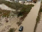 A drone view shows a vehicle stranded in an area flooded by the Wallace River, as an atmospheric river brings rain and flooding to the Pacific Northwest, in Gold Bar, Washington, U.S., December 10, 2025.  REUTERS/David Ryder