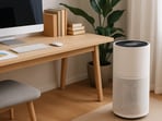 A compact HEPA air purifier can quietly clean the air while you work.​(AI generated)