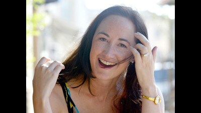 Author Sophie Kinsella poses on Wimbledon Village high street, London on September 9, 2004. (AP Photo/Adam Butle, File) Author Sophie Kinsella poses on Wimbledon Village high street, London on September 9, 2004. (AP Photo/Adam Butle, File)