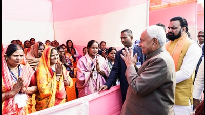 Bihar CM Nitish Kumar, along with Deputy Chief Minister Samrat Chaudhary, greets the rural women at the Higher Secondary School at Kesaria in East Champaran on Thursday (ANI)