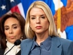 Attorney General Pam Bondi, with U.S. Attorney Jeanine Pirro behind, pauses while speaking during a news conference at the Department of Justice, Thursday, Dec. 4, 2025, in Washington. (AP Photo/Alex Brandon)