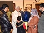 J&K LG Manoj Sinha with family of one of the victims in Nowgam on Friday. (Sourced)