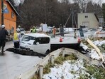 A vehicle is seen on a collapsed road in Tohoku town in Aomori Prefecture on December 9, 2025, following a 7.5 magnitude earthquake off northern Japan.