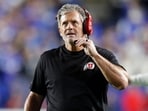 Kyle Whittingham head coach of the Utah Utes talks into his headset during the second half of their game against the Brigham Young Cougars Kyle Whittingham head coach of the Utah Utes talks into his headset during the second half of their game against the Brigham Young Cougars